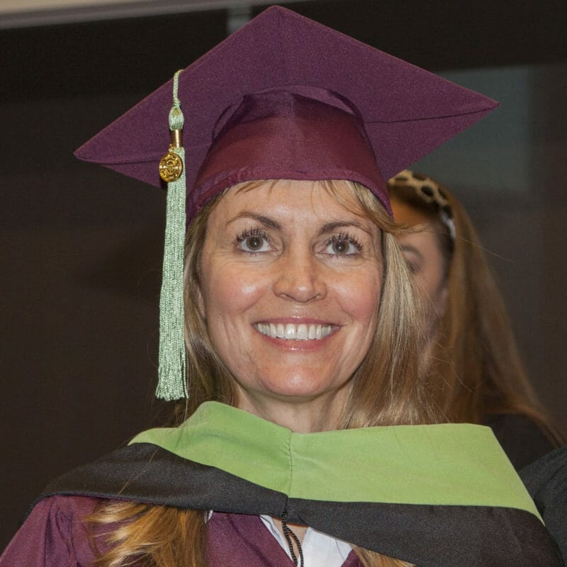 Graduation headshot of Jaime Bohan in cap and gound