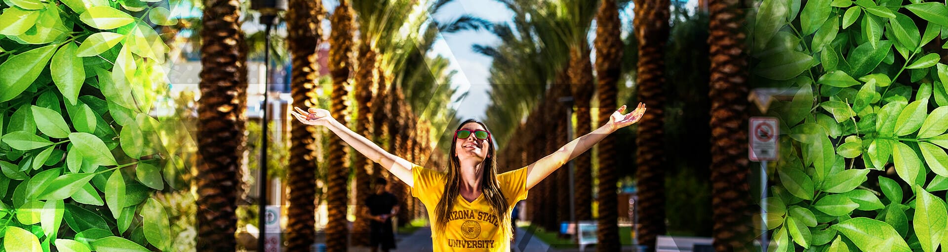 student with arms out