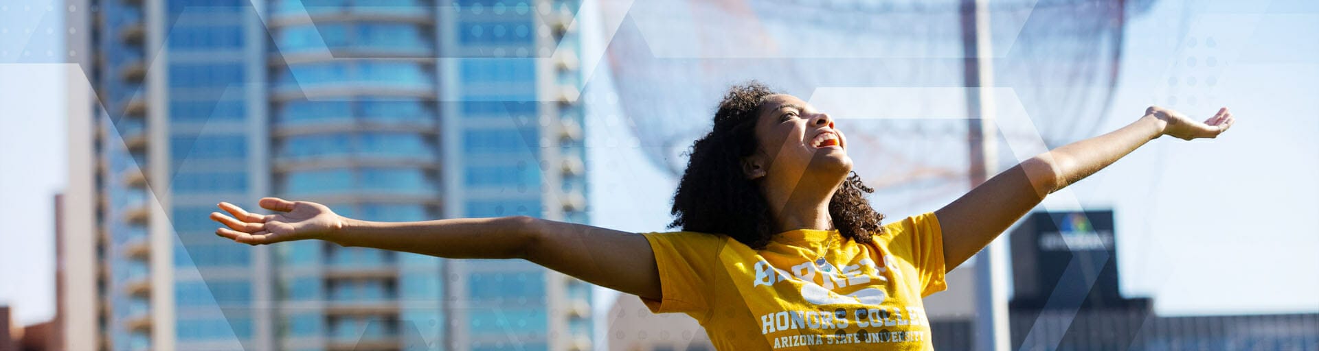 student with arms wide open